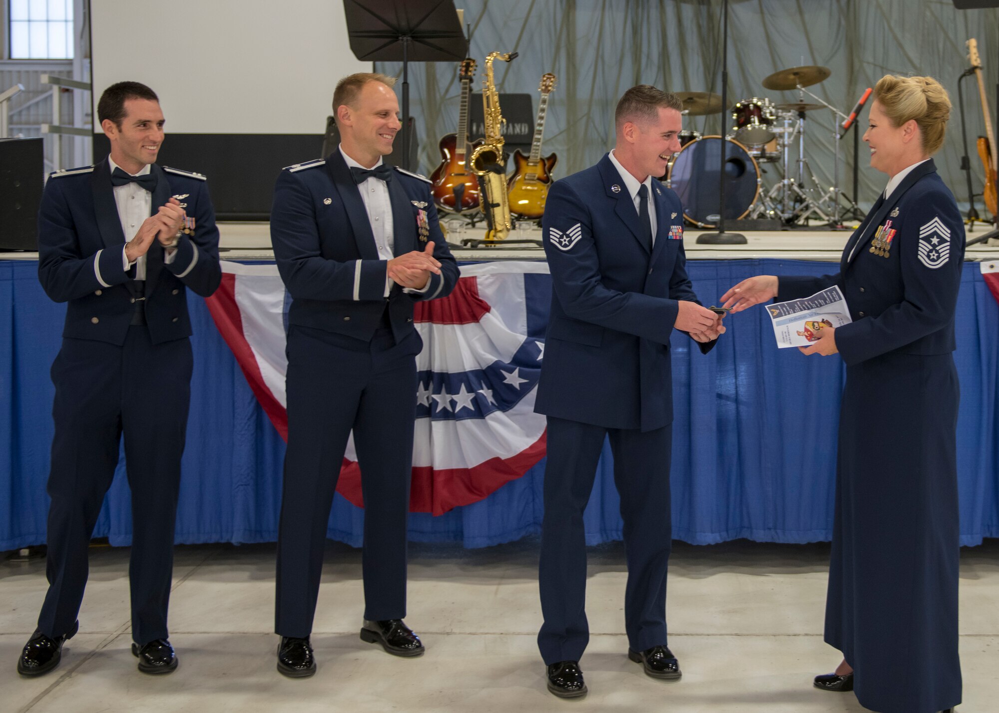 Chief Master Sgt. Sarah Esparza, 49th Wing command chief, congratulates newly promoted Tech. Sgt. Kyle Saxon, 54th Operations Support Squadron operations flight chief, on his promotion at the Air Force Ball, Sept. 14, 2019, on Holloman Air Force Base, N.M. This Saxon promoted from staff sergeant to technical sergeant through the Stripes for Exceptional Performers program. (U.S. Air Force photo by Airman 1st Class Kindra Stewart)
