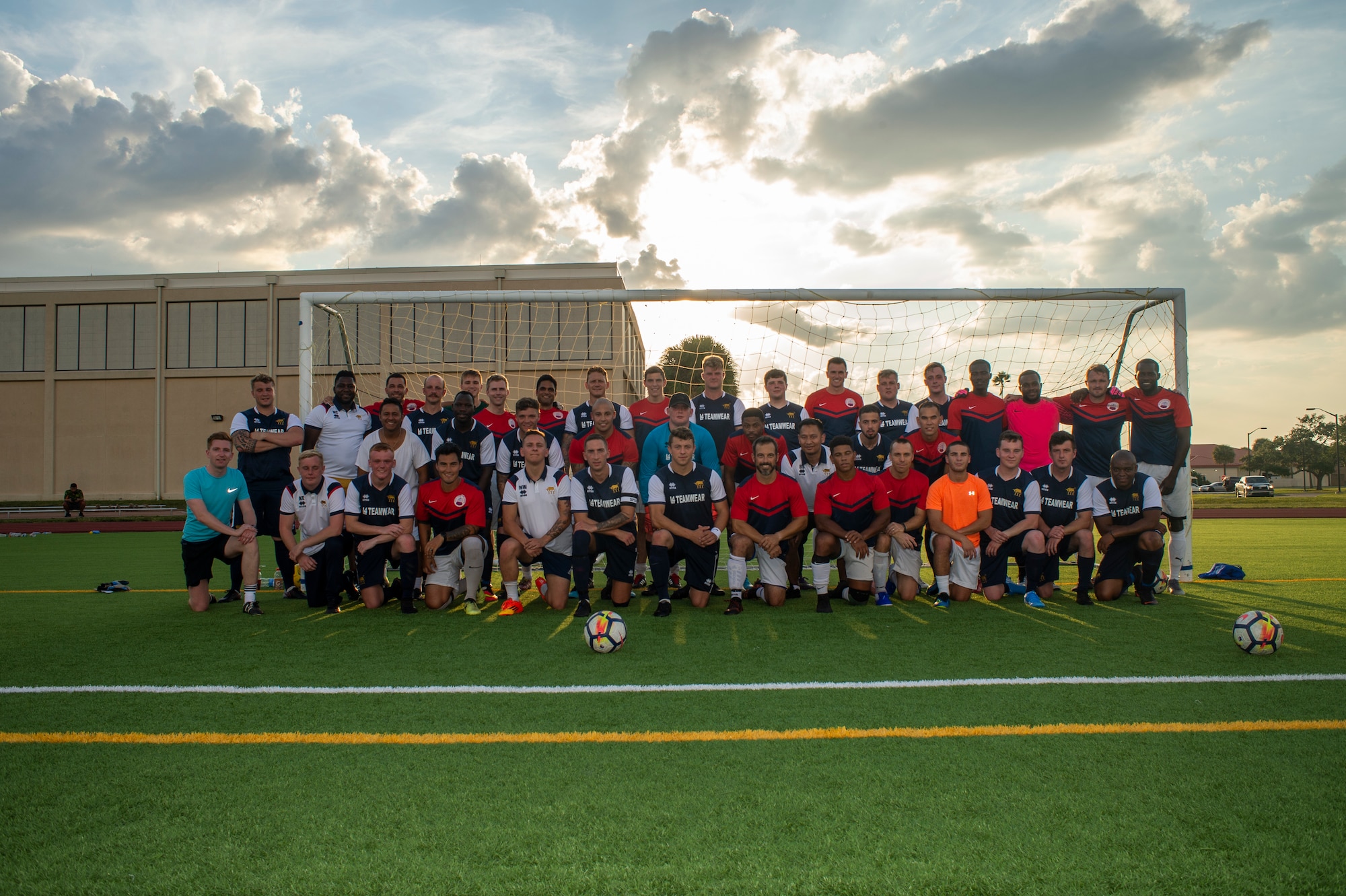 Service members from the British armed forces and MacDill Air Force Base, pause for a group photo prior to a friendly soccer game Sept. 9, 2019. The game was an opportunity to build comradery and strengthen the bonds of NATO allies. (U.S. Air Force photo by Staff Sgt. Rito Smith)