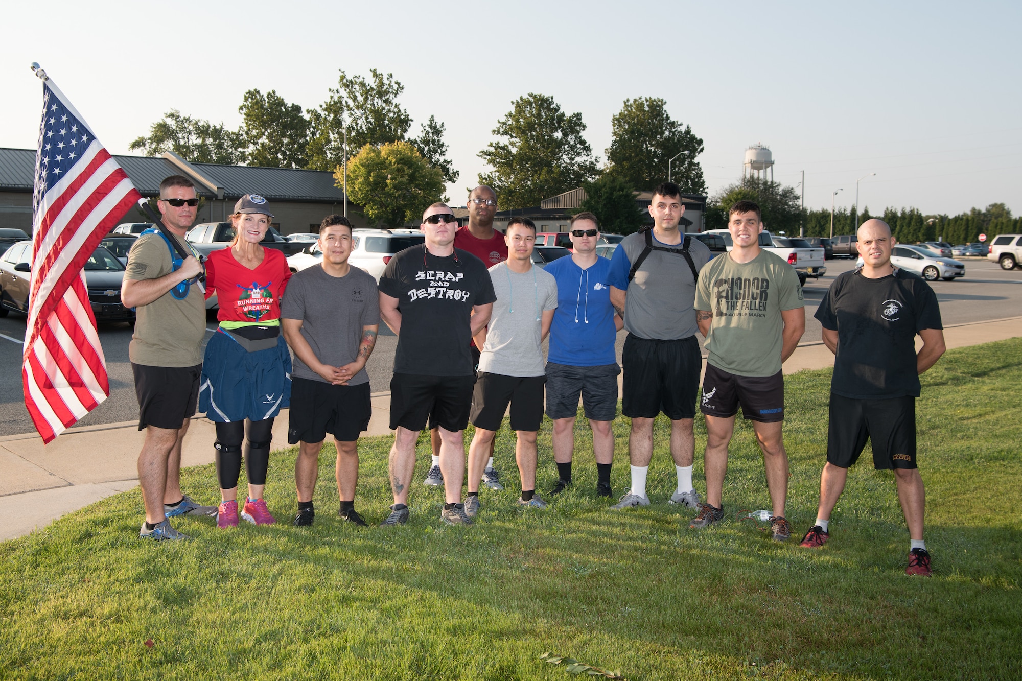 Master Sgt. Trevor Derr, 736th Aircraft Maintenance Squadron C-17 production superintendent (far left), and Cathy Powers, Gold Star Mother, stand with Airmen, Soldiers and Marines before the “Running Fir Wreaths” campaign Sept. 12, 2019, at Dover Air Force Base, Del. The group ran from Dover AFB to Legislative Hall in downtown Dover. (U.S. Air Force Photo by Mauricio Campino)