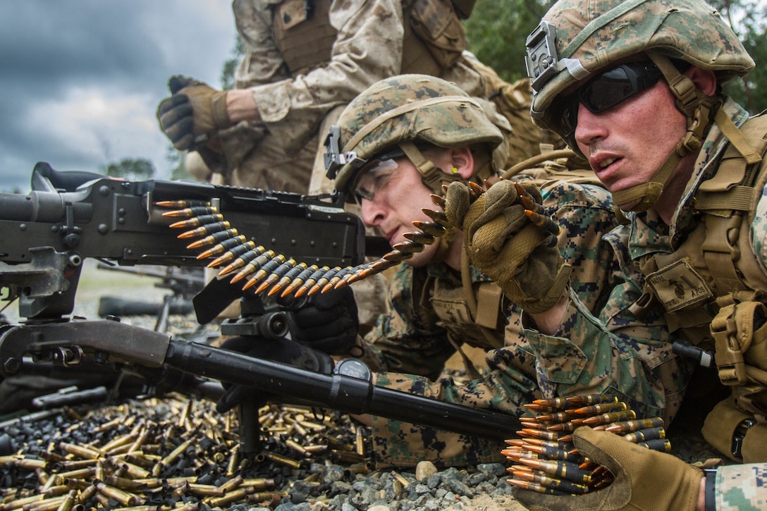 Second Lieutenants Tom Vasko and Phillip Haly, students at the Basic Officer Course, fire their M240 medium machine gun during the Crew Served Weapons Live Fire Exercise, at Marine Corps Base Quantico, Virginia, August 27, 2019. The Basic Officer Course is eight months long and is designed to train and educate newly commissioned or appointed officers in the high standards of professional knowledge, esprit-de-corps, and leadership to prepare them for duty as company grade officers in the Marine Corps, with particular emphasis on the duties, responsibilities, and warfighting skills required of a rifle platoon commander.