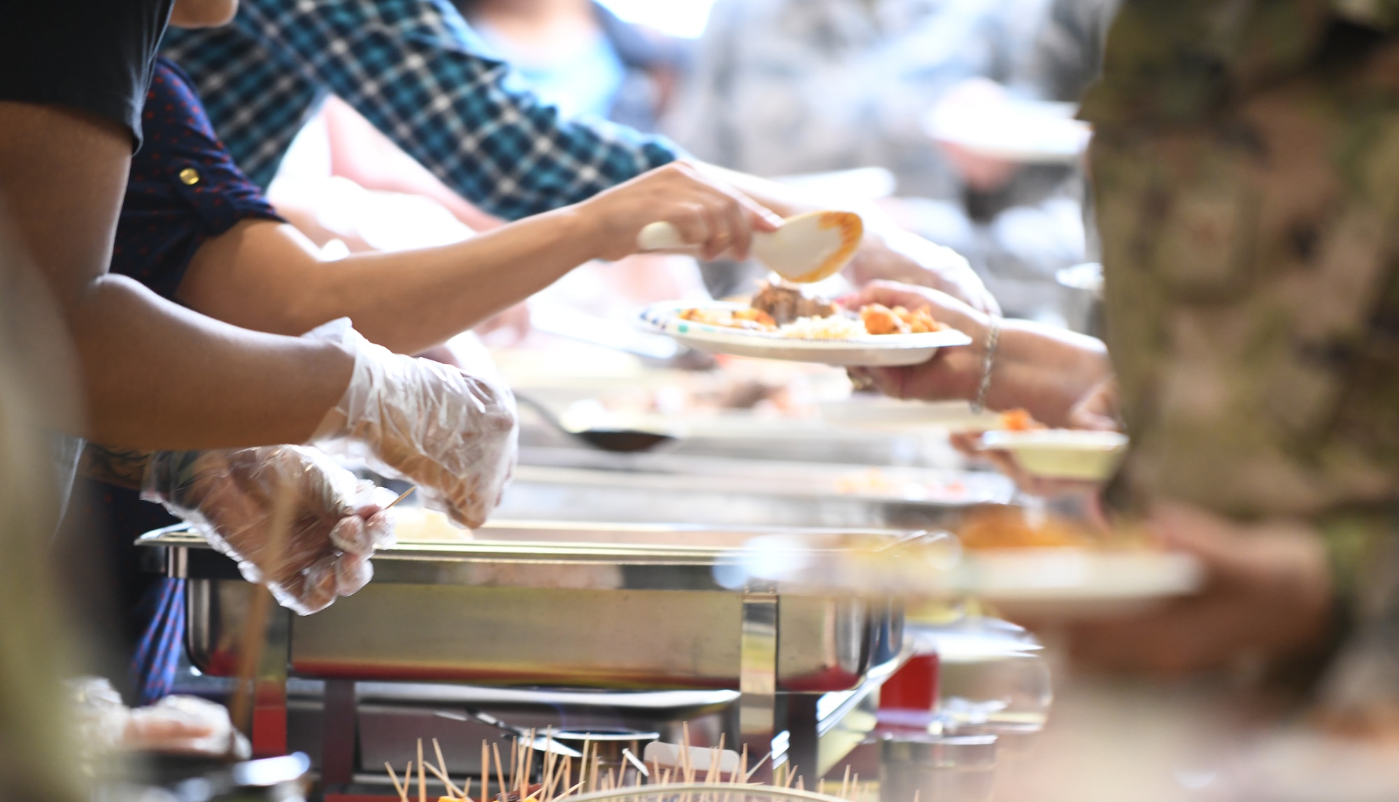 Airmen are served authentic Latin American food during a food tasting event at the Base Exchange food court on Ellsworth Air Force Base, S.D., Sept. 16, 2019. The event was held to mark the beginning of National Hispanic Heritage Month, which runs from Sept. 15 through Oct. 15. Hispanic Heritage Month brings awareness to the many contributions made by Latin Americans to the United States. (U.S. Air Force photo by Airman 1st Class Christina Bennett)