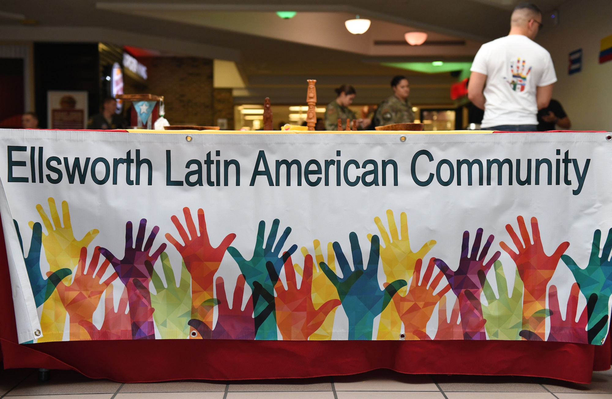 The Ellsworth Latin American Community (ELAC) sets up a ‘Taste of Latin America’ food tasting event, held at the Base Exchange food court, on Ellsworth Air Force Base, S.D., Sept. 16, 2019. The event kicked off the beginning of National Hispanic Heritage Month, which runs from Sept. 15 through Oct. 15. (U.S. Air Force photo by Airman 1st Class Christina Bennett)