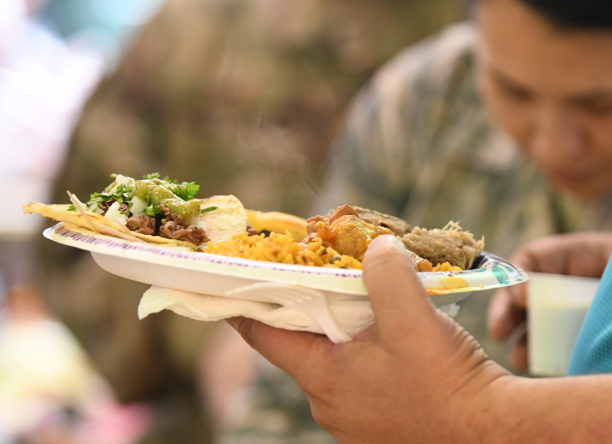 Airmen are served authentic Colombian, Cuban, Mexican and Puerto Rican dishes during the ‘Taste of Latin America’ food tasting event at the Base Exchange food court on Ellsworth Air Force Base, S.D., Sept. 16, 2019. The event was held in recognition of National Hispanic Heritage Month, which is observed from Sept. 15 through Oct. 15. Sept. 15 is significant because it marks the anniversary of independence for five Latin American countries – El Salvador, Guatemala, Honduras, Nicaragua and Costa Rica. (U.S. Air Force photo by Airman 1st Class Christina Bennett)