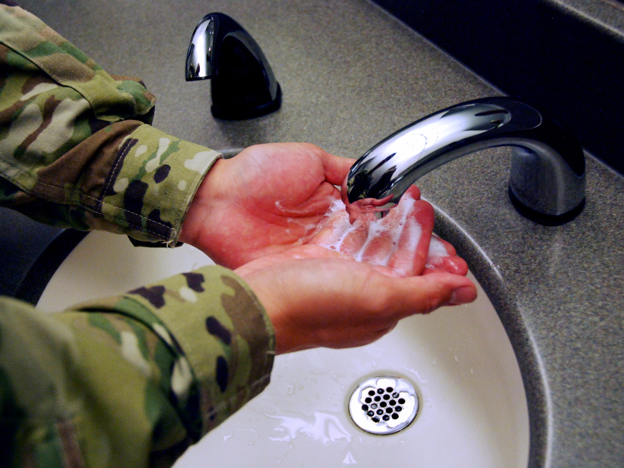 Proper handwashing can help prevent the spread of infectious disease. The Centers for Disease Control and Prevention offers guidelines on how to do it effectively. First, wet your hands with clean, running water. Next, apply soap and lather your hands. Scrub your hands for at least 20 seconds, making sure to get the backs of your hands and under your nails. Finally, rinse your hands under clean, running water and dry them. (U.S. Air Force photo by Griffin Swartzell)
