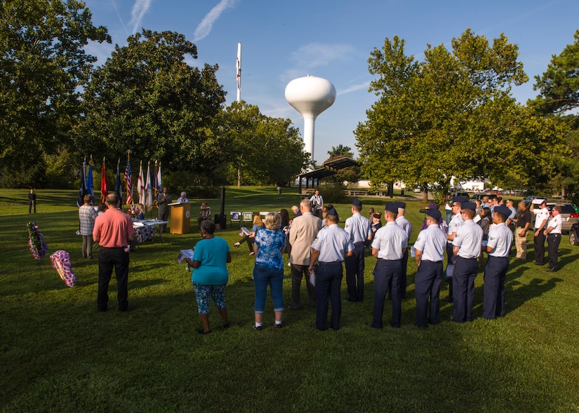 U.S. Air Force Airmen from the 30th Intelligence Squadron, city officials and local residents honor the victims lost in the 2001 terrorist attack during the 18th annual “Reading of the Names” at Gosnold's Hope Park, Sept. 11, 2019. Each volunteer was givens sheet of paper with the names of the fallen and read them aloud around the memorial trees in the park. (U.S. Air Force Photo by Tech Sgt. Carlin Leslie)