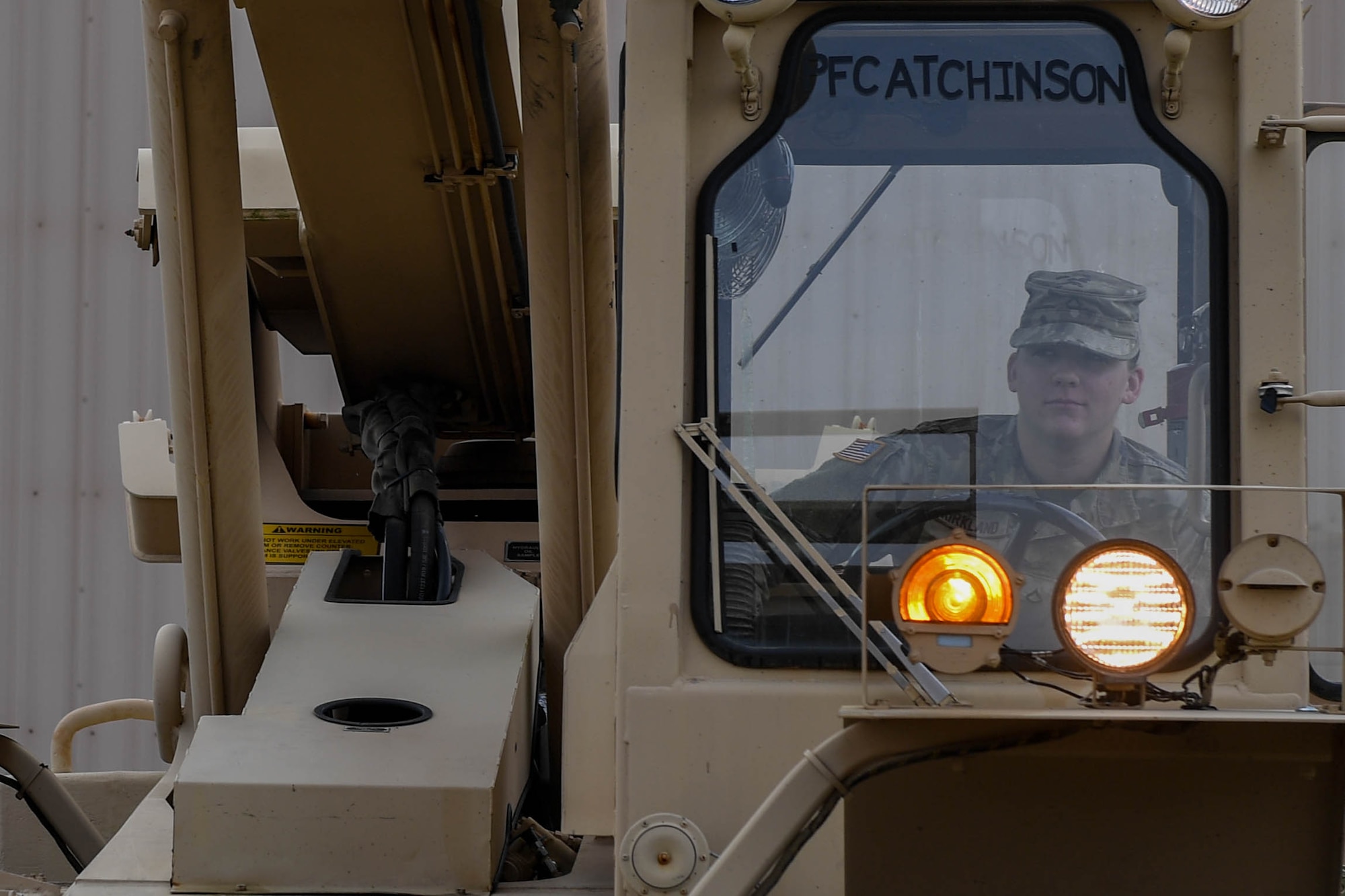 U.S. Army Pfc. Staci Kirkland, cargo specialist with the 597th Transportation Brigade, 832nd Trans. Battalion, 688th Rapid Port Opening Element, raises the arm of a forklift at Joint Base Langley-Eustis, Virginia, Sept. 16, 2019. The 10K forklift is used by the 688th RPOE during training to ensure Soldiers are experienced in the functions of the machine. (U.S. Air Force photo by Senior Airman Derek Seifert)