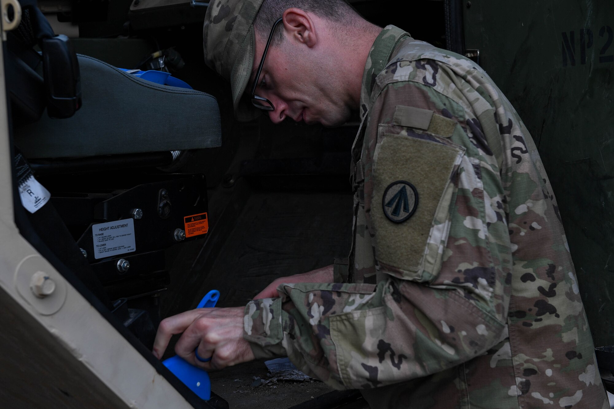 U.S. Army Spc. Daniel Mitchell, a heavy vehicle operator assigned to the 597th Transportation Brigade, 832nd Trans. Battalion, 688th Rapid Port Opening Element, sweeps out the cab of a truck during preventative maintenance checks at Joint Base Langley-Eustis, Virginia, Sept. 16, 2019. The Soldiers of the 688th RPOE are not only responsible for the upkeep and maintenance of the unit’s vehicles, but also ensuring they are clean. (U.S. Air Force photo by Senior Airman Derek Seifert)
