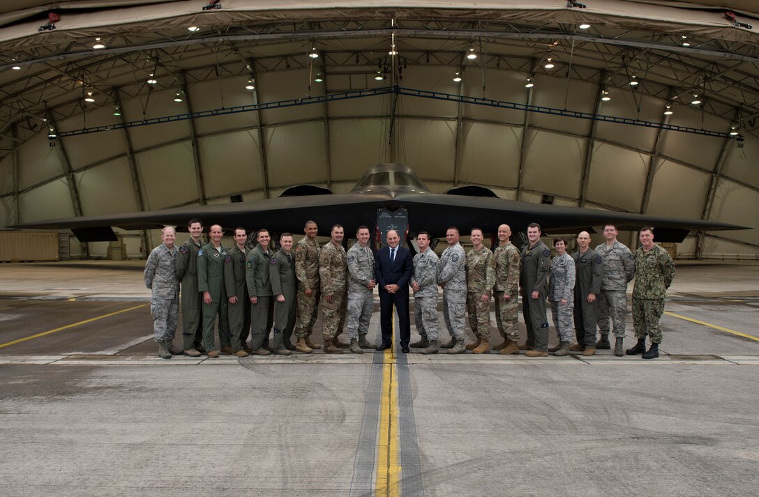 The Honorable Ben Wallace, United Kingdom  secretary of state for defence, along with members of his entourage, pose for a photo with members of the Bomber Task Force assigned to Whiteman Air Force Base, Missouri, on September 16, 2019, at Royal Air Force Fairford, England. Wallace came to Royal Air Force Fairford to learn about the Bomber Task Force and the B-2 Spirit from 509th Bomb Wing maintainers and pilots.(U.S. Air Force photo by Staff Sgt. Kayla White)