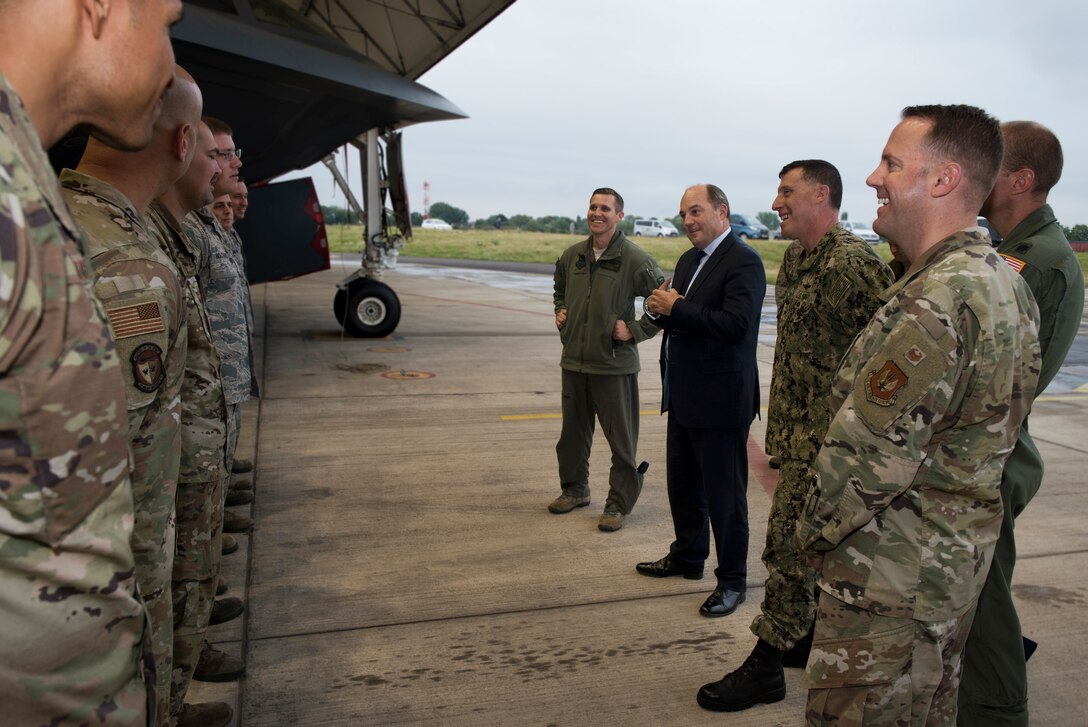 Lieutenant Colonel Rob Schoeneberg, the Bomber Task Force Europe commander assigned to Whiteman Air Force Base, Missouri, and the Honorable Ben Wallace, United Kingdom secretary of state for defence, along with members of his entourage, engage with 509th Maintenance Group Airmen on September 16, 2019, at Royal Air Force Fairford, England. Wallace came to Royal Air Force Fairford to learn about the Bomber Task Force and the B-2 Spirit from members of Whiiteman Air Force Base, Missouri. (U.S. Air Force photo by Staff Sgt. Kayla White)
