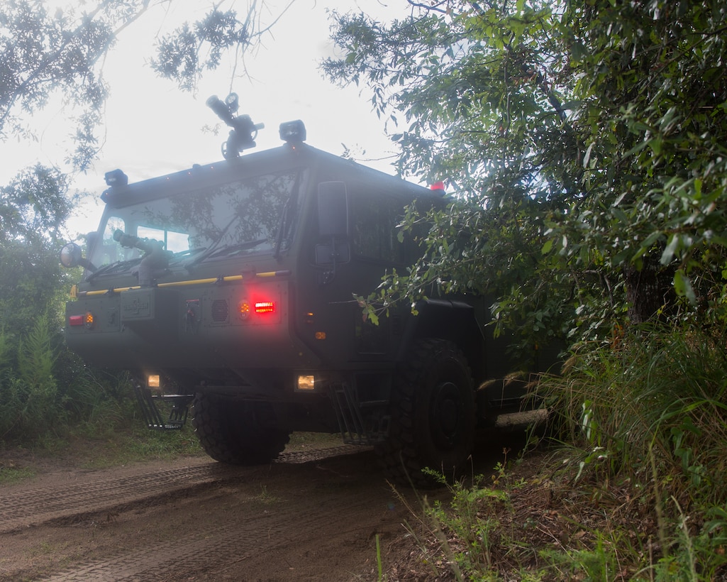 Aircraft Recovery and Fire Fighting (ARFF) Marines arrive to the scene of a crashed plane during an aircraft recovery scenario at Marine Corps Auxiliary Landing Field Bogue, North Carolina, Aug. 16, 2019. ARFF Marines attached to Marine Wing Support Detachment 273 trained to improve readiness, efficiency, and recovery times.