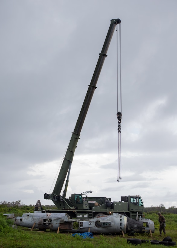 Aircraft Recovery and Fire Fighting (ARFF) Marines utilize a crane to remove a plane from a crash site during an aircraft recovery scenario at Marine Corps Auxiliary Landing Field Bogue, North Carolina, Aug. 16, 2019. ARFF Marines attached to Marine Wing Support Detachment 273 trained to improve readiness, efficiency, and recovery times.