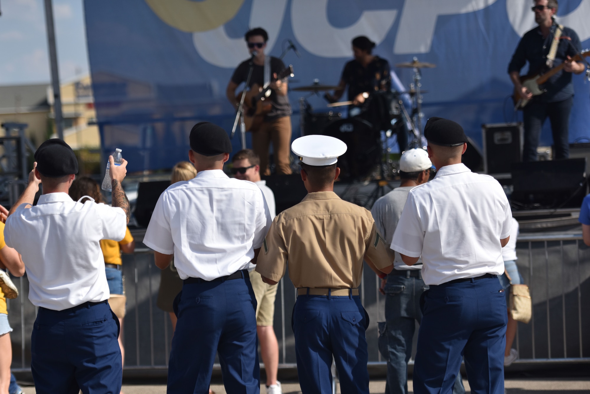 Soldiers and Marines from Goodfellow enjoy live music during the 2019 Ram Jam before the Angelo State Military Appreciation night at the LeGrand Alumni Visitor Center in San Angelo, Texas, Sept. 14, 2019. The headlining artist this year was Chris Allen, American Idol 8th season participant. (U.S. Air Force photo by Senior Airman Seraiah Wolf/Released)