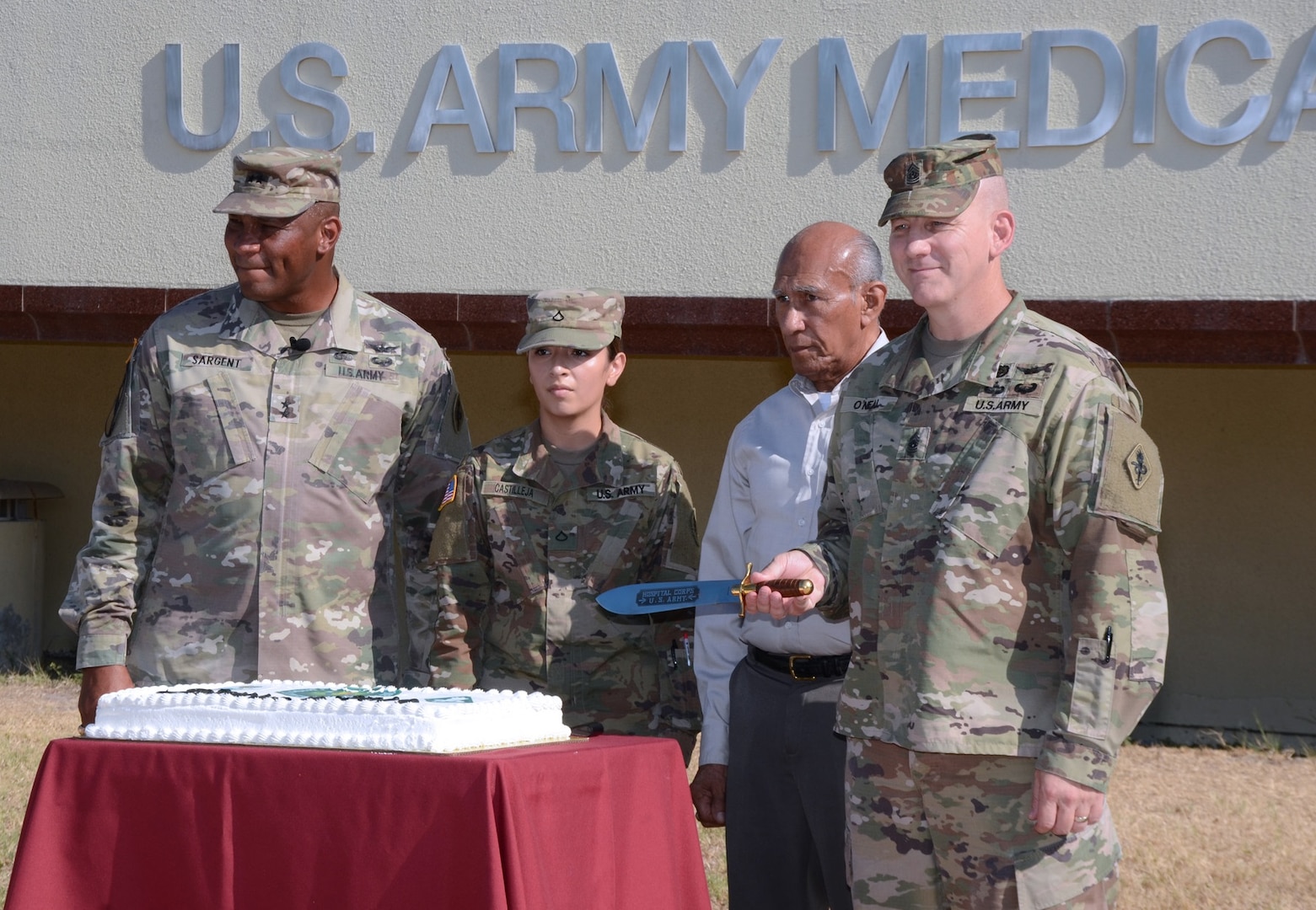 To celebrate the redesignation to U.S. Army Medical Center of Excellence, or MEDCoE, the command also conducted a cake-cutting ceremony at Joint Base San Antonio-Fort Sam Houston Sept. 16. Assisting Maj. Gen. Patrick D. Sargent and Command Sgt. Maj. William "Buck" O'Neal were the most junior and most senior personnel in the command, as is a time-honored military tradition. Instead of a sabre, MEDCoE cut their ceremonial cake with a replica of the Hospital Corps knife, which was established in 1887. Pictured (from left) are Sargent, Pvt. 1st Class Briana Castilleja Hernandez, Jesus Serbantez, and O’Neal.