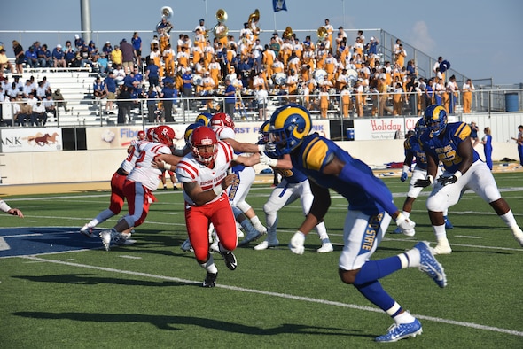Angelo State University Rams and Simon Fraser University players compete during the ASU military appreciation night at 1st Community Credit Union Field, San Angelo, Texas, Sept. 14, 2019. ASU hosted SFU, a Canadian football team and won the game 68-7. (U.S. Air Force photo by Senior Airman Seraiah Wolf/Released)