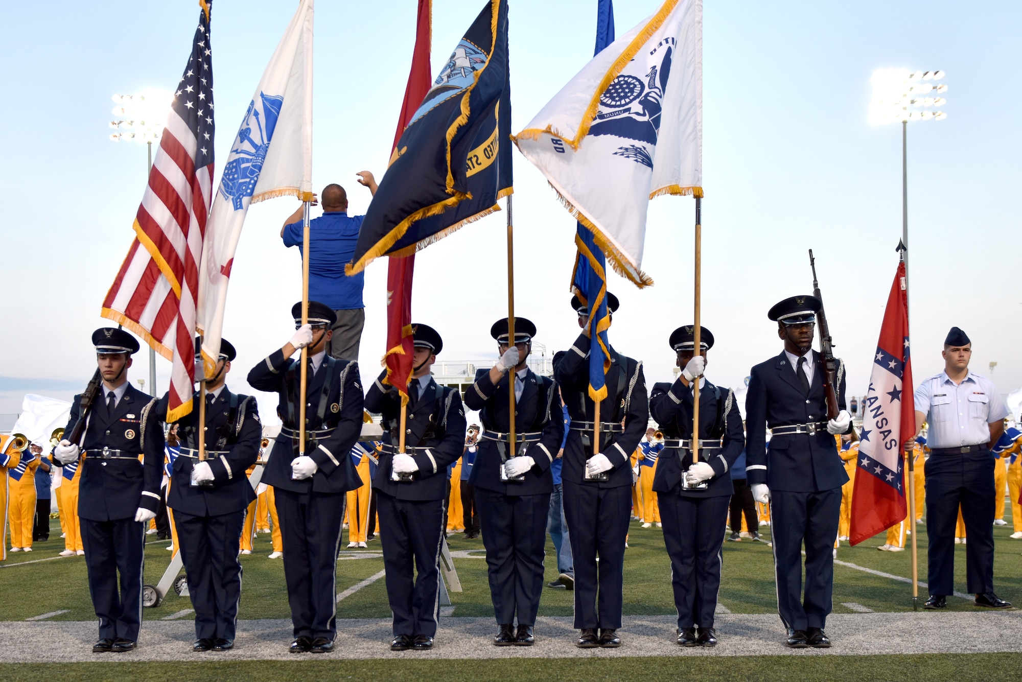 Goodfellow Honor Guard members present the colors during the halftime show of the Angelo State University vs Simon Fraser University game during military appreciation night at the 1st Community Credit Union Field, San Angelo, Texas, Sept. 14, 2019. Military members and their families could attend the 2019 Ram Jam and game for free with a valid military ID. (U.S. Air Force photo by Senior Airman Seraiah Wolf/Released)