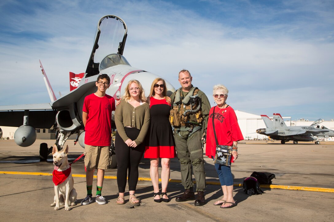 U.S. Marine Corps Lt. Col. Mark Bortnem, the commanding officer of Marine Fighter Attack Squadron (VMFA) 232 “Red Devils”, 3rd Marine Aircraft Wing, reunites with his wife during a homecoming ceremony at Marine Corps Air Station Miramar, Calif., September 15, 2019. The Red Devils spent six months deployed as part of the unit deployment program. (U.S. Marine Corps photo by Sgt. Victoria Decker)