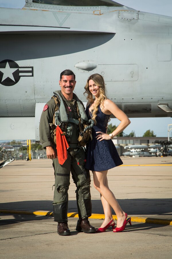 U.S. Marine Corps Capt. Jon Martinez, an F/A-18C Hornet pilot with Marine Fighter Attack Squadron (VMFA) 232 “Red Devils”, 3rd Marine Aircraft Wing, reunites with his wife during a homecoming ceremony at Marine Corps Air Station Miramar, Calif., September 15, 2019. The Red Devils spent six months deployed as part of the unit deployment program. (U.S. Marine Corps photo by Sgt. Victoria Decker)