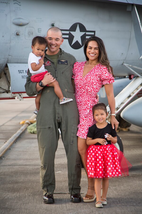 U.S. Marine Corps Maj. Ryan Franzen, an F/A-18C Hornet pilot with Marine Fighter Attack Squadron (VMFA) 232 “Red Devils”, 3rd Marine Aircraft Wing, reunites with his family during a homecoming ceremony at Marine Corps Air Station Miramar, Calif., September 15, 2019. The Red Devils spent six months deployed as part of the unit deployment program. (U.S. Marine Corps photo by Sgt. Victoria Decker)