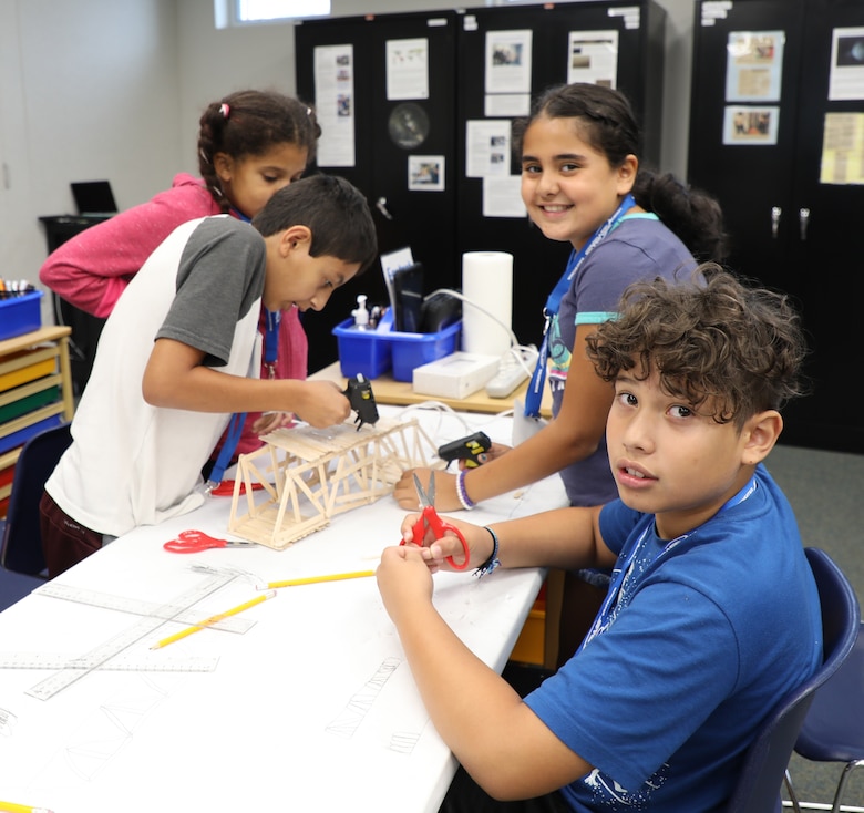 Students from Armel Elementary School in Frederick County, Virginia, construct a popsicle stick bridge using only glue guns, their own designs, and 100 popsicle sticks. The kids were participating in STARBASE, a Defense Department program designed to motivate fifth graders to explore educational opportunities in Science, Technology, Engineering, and Math (STEM) fields. The National Guard’s STARBASE Academy in Winchester is the only STARBASE program in Virginia, and hosts 56-58 courses a year for area schools.