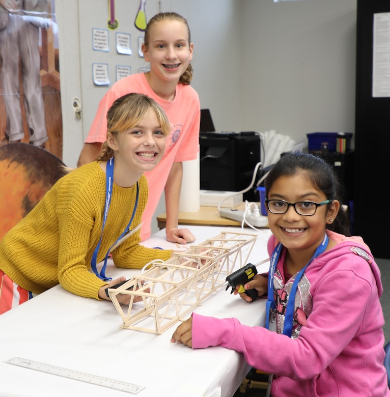 Students from Armel Elementary School in Frederick County, Virginia, build a popsicle stick bridge using only glue guns, their own designs, and 100 popsicle sticks. The kids were participating in STARBASE, a Defense Department program designed to motivate fifth graders to explore educational opportunities in Science, Technology, Engineering, and Math (STEM) fields. The National Guard’s STARBASE Academy in Winchester is the only STARBASE program in Virginia, and hosts 56-58 courses a year for area schools.