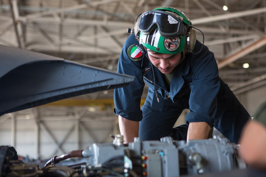 Marine Sgt. Salvatore F. Cuneo, an avionics technician with Marine Attack Training Squadron 203, inspects the engine of an T/AV-8B Harrier II prior to it being moved to outside storage at Marine Corps Air Station Cherry Point, North Carolina, Sep. 16, 2019. Marines attached to VMAT-203 execute daily maintenance to ensure dependability of the aircraft as well as the capability for it be ready at any moment’s notice. VMAT-203 is a part of Marine Aircraft Group 14, 2nd Marine Aircraft Wing. (U.S. Marine Corps photo by Lance Cpl. Elias E. Pimentel III)