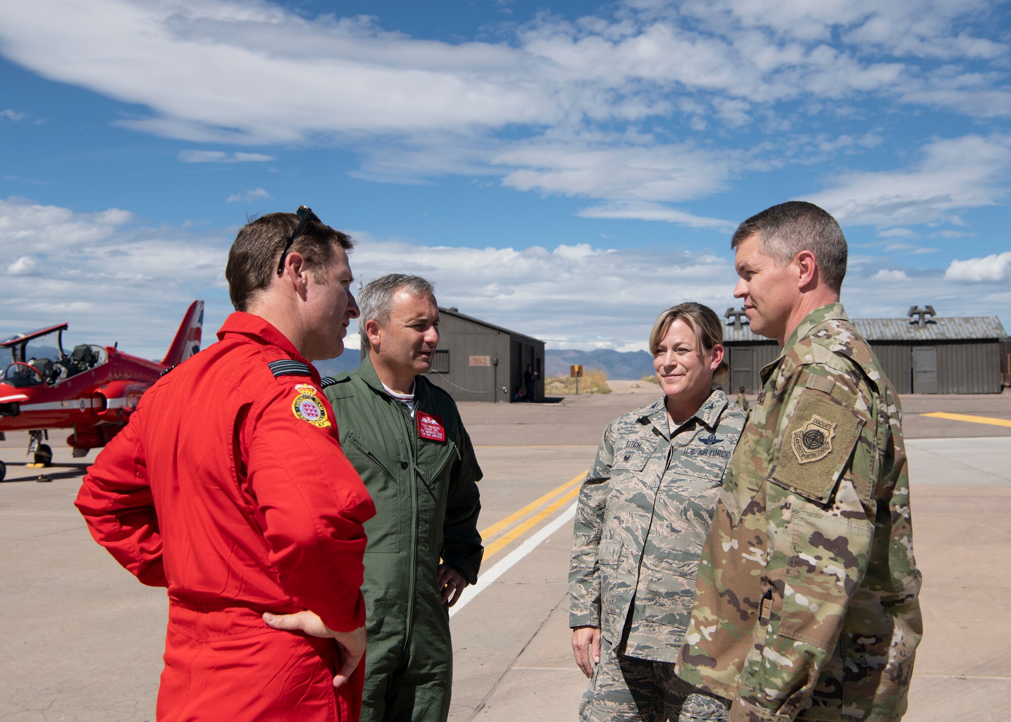 From left, Wing Commander Andrew Keith and Group Captain Tony Franklin, Royal Air Force, meet Col. Jennifer Fitch, individual mobilization augmentee to the 21st Space Wing commander, and Col. Sam Johnson, 21st Space Wing vice commander Sept. 16, 2019 at Peterson Air Force Base, Colorado. Keith and Franklin were visiting with the Red Arrows, the Royal Air Force aerial demonstration team during the team’s North American tour. (U.S. Air Force photo by Heather Heiney)