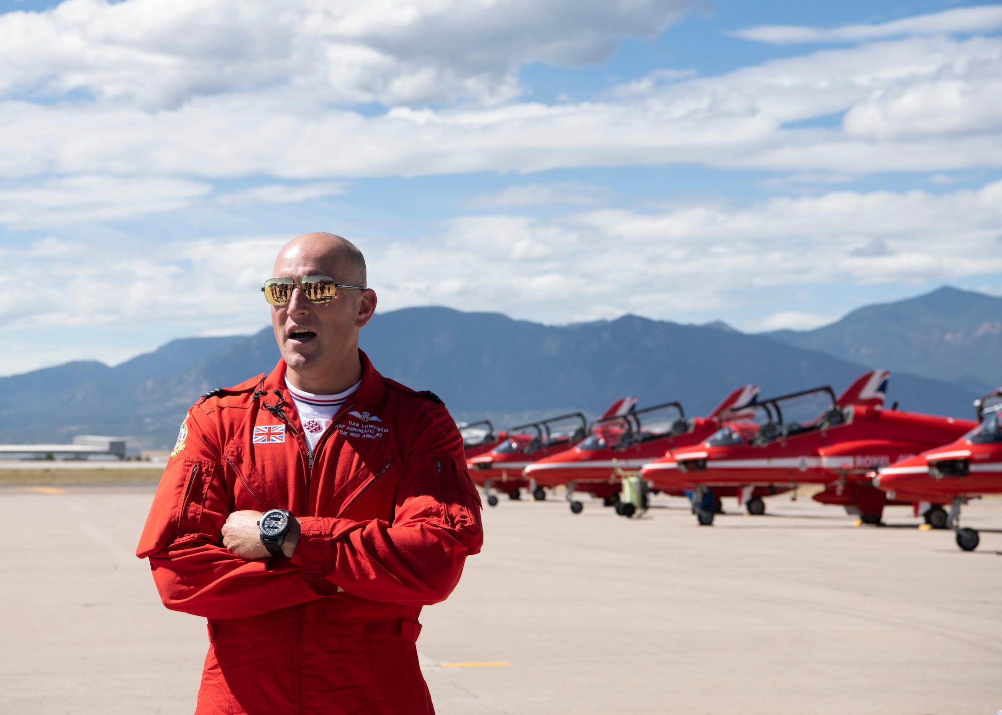 Flight Lieutenant Dan Lowes, member of the Royal Air Force demonstration team the Red Arrows, speaks to members of Colorado Springs media outlets Sept. 16, 2019 at Peterson Air Force Base, Colorado. Lowes was visiting the base as part of the Red Arrows 2019 North American tour. (U.S. Air Force photo by Heather Heiney)