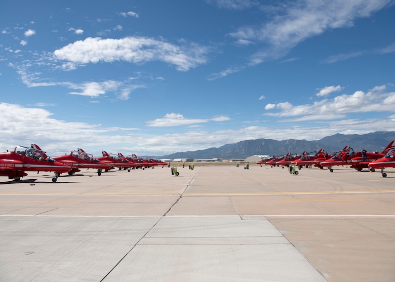 Royal Air Force Hawk T1 aircraft are checked by maintainers after landing on the flight line Sept. 16, 2019 at Peterson Air Force Base, Colorado. The aircraft are used by the aerial demonstration team, the Red Arrows. (U.S. Air Force photo by Heather Heiney)