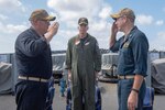 SEA OF JAPAN (Sept. 17, 2019) Rear Adm. Karl Thomas, Commander, Task Force 70 and Carrier Strike Group 5 observes as Capt. Russel Caldwell, left, relieves Capt. James Storm as commanding officer of the Ticonderoga-class guided-missile cruiser USS Antietam (CG 54)  during a change of command ceremony. Antietam is forward deployed to the U.S. 7th Fleet area of operations in support of security and stability in the Indo-Pacific region.
