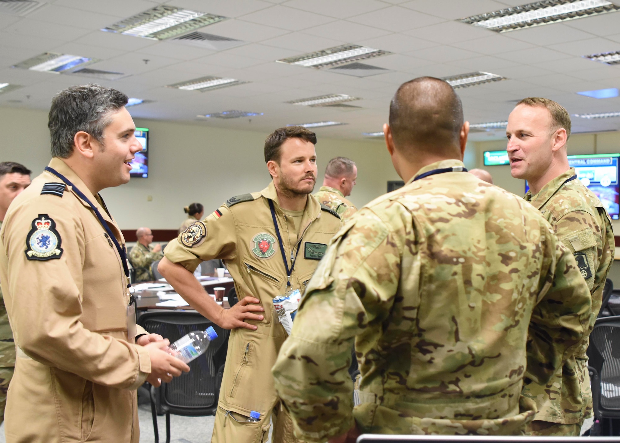Group of U.S. and Coalition service members has a chat.