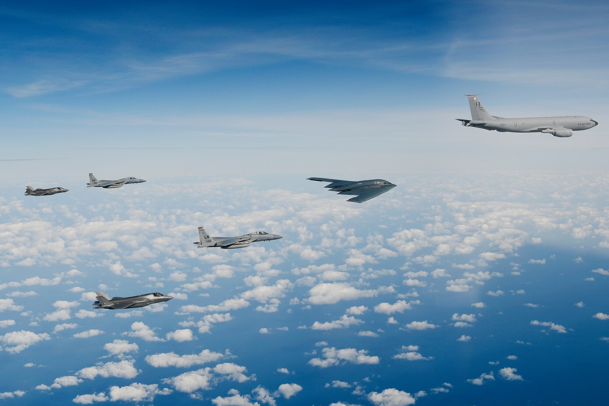 A delta formation consisting of a B-2A Spirit bomber assigned to the 509th Bomb Wing, two F-15C Eagles assigned to the 48th Fighter Wing and two Royal Air Force F-35B Lightnings as they conduct aerial refuelling operations with a KC-135 Stratotanker assigned to the 100th Air Refuelling Wing over the North Sea Sept. 16, 2019. The 48th Fighter Wing and the Royal Air Force routinely train with integrated 4th and 5th generation capabilities to deliver full spectrum air combat support to European allies and partners. (U.S. Air Force photo/ Tech. Sgt. Matthew Plew)