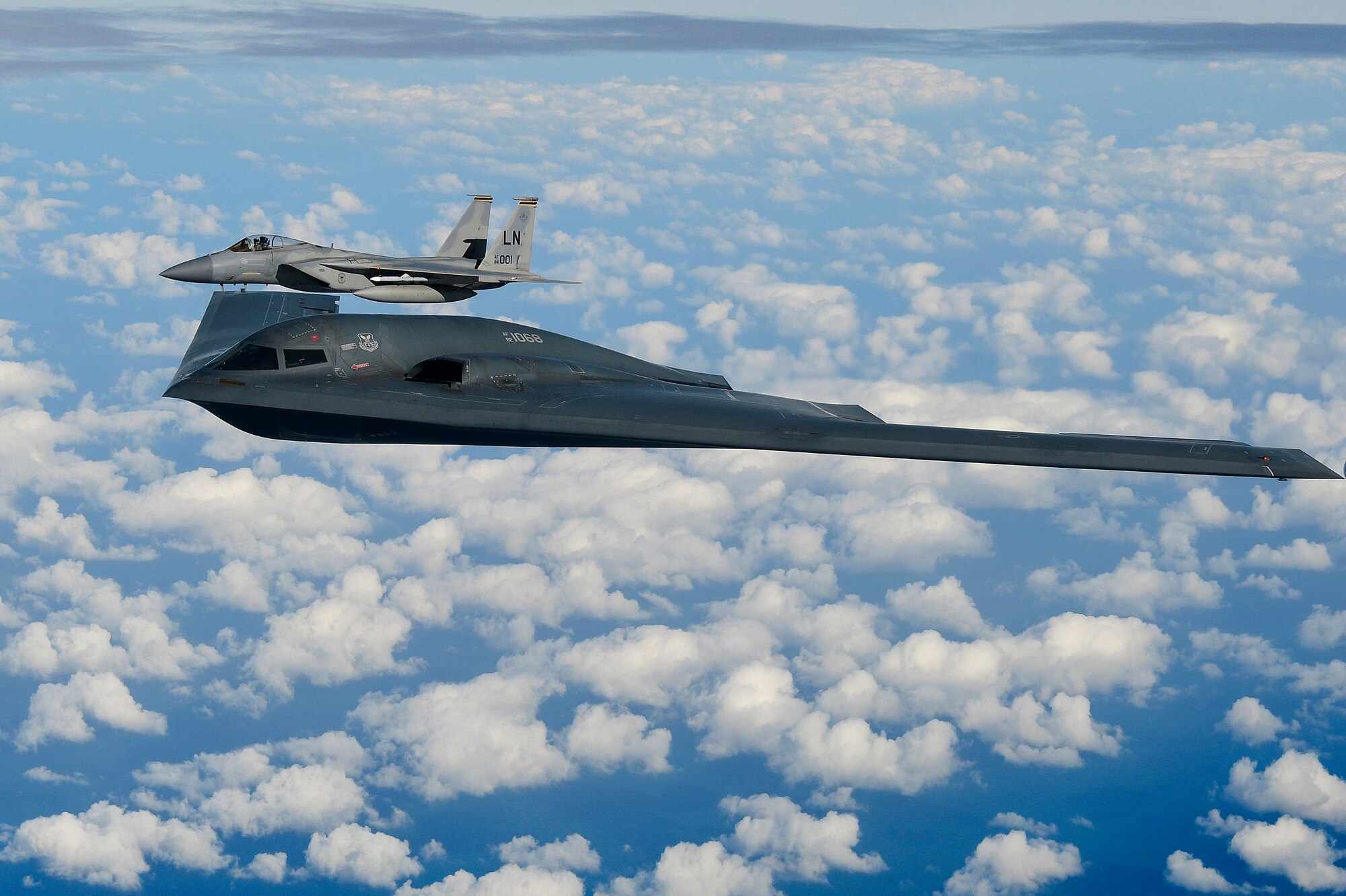 A B-2A Spirit bomber assigned to the 509th Bomb Wing an F-15C Eagle assigned to the 48th Fighter Wing conduct aerial operations over the North Sea Sept. 16, 2019. The 48th Fighter Wing routinely trains with integrated aerial platform capabilities to deliver full spectrum air combat support to European allies and partners. (U.S. Air Force photo/ Tech. Sgt. Matthew Plew)