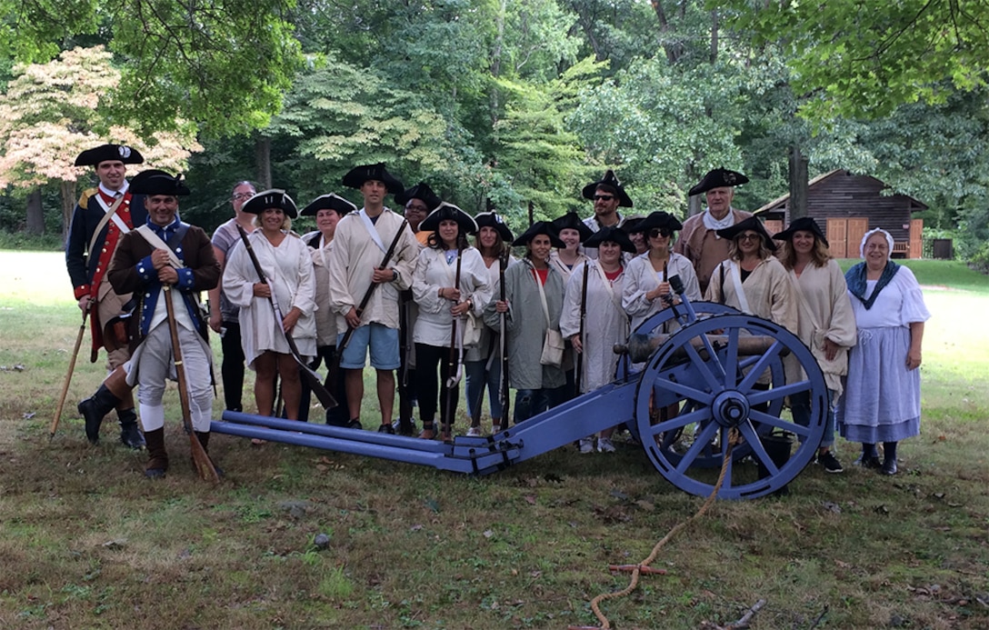 Schoolteachers pose during a recent training session with the Living History Education Foundation. Using U.S. Army Revolutionary-era uniforms and military items donated via DLA Disposition Services, the foundation helps history instructors plan immersive lessons and borrow equipment to help students better understand historic events like the Battle of Bunker Hill.