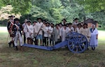 Schoolteachers pose during a recent training session with the Living History Education Foundation. Using U.S. Army Revolutionary-era uniforms and military items donated via DLA Disposition Services, the foundation helps history instructors plan immersive lessons and borrow equipment to help students better understand historic events like the Battle of Bunker Hill.