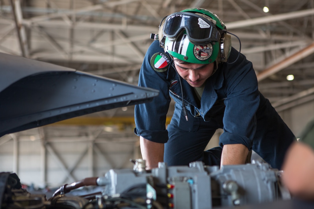 Sgt. Salvatore F. Cuneo, an avionics technician with Marine Attack Training Squadron 203, Marine Aircraft Group 14, 2nd Marine Aircraft Wing, inspects the engine of an T/AV-8B Harrier II prior to it being moved to outside storage at Marine Corps Air Station Cherry Point, North Carolina, Sep. 16, 2019. Marines attached to VMAT-203 execute daily maintenance to ensure dependability of the aircraft as well as the capability for it be ready at any moment’s notice. (U.S. Marine Corps photo by Lance Cpl. Elias E. Pimentel III)