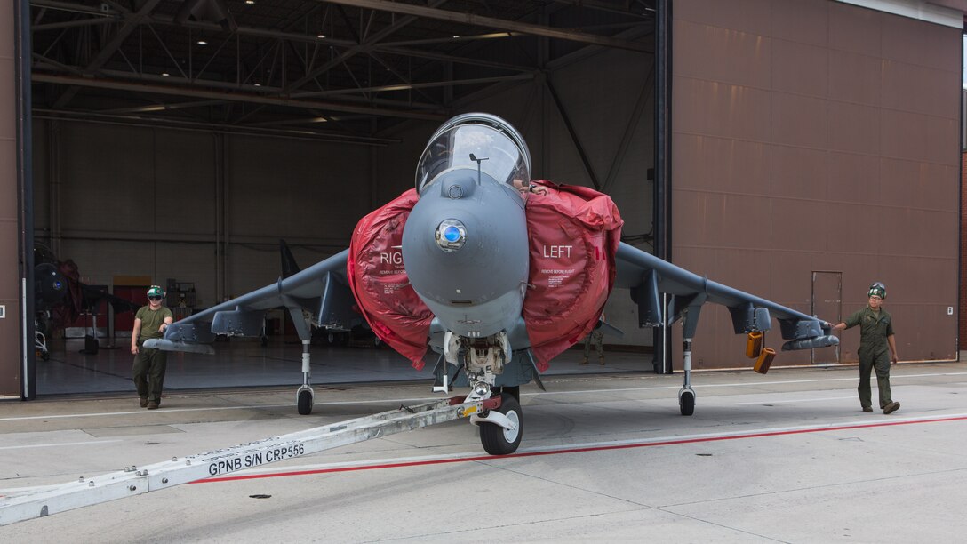 Marines attached to Marine Attack Training Squadron 203, Marine Aircraft Group 14, 2nd Marine Aircraft Wing, taxi an T/AV-8B Harrier II to outside storage at Marine Corps Air Station Cherry Point, North Carolina, Sep. 16, 2019. Marines attached to VMAT-203 execute daily maintenance to ensure dependability of the aircraft as well as the capability for it be ready at any moment’s notice. (U.S. Marine Corps photo by Lance Cpl. Elias E. Pimentel III)