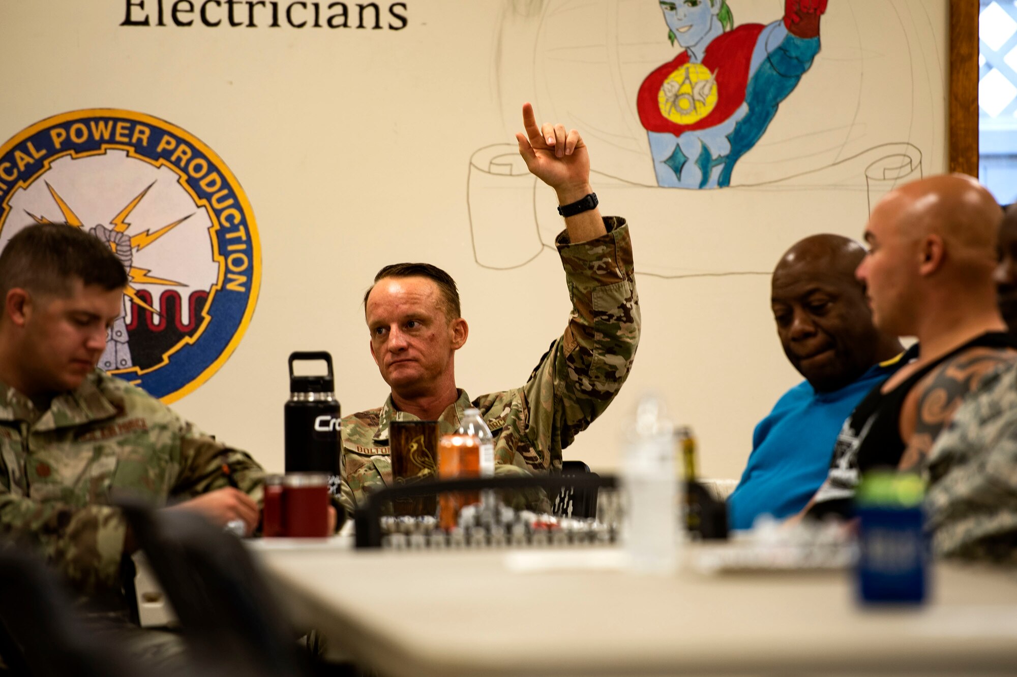 Senior Master Sgt. Noah Bolton, 23d Civil Engineer Squadron readiness & emergency flight chief, raises his hand during resiliency training Sept. 10, 2019, at Moody Air Force Base, Ga. The event was hosted by the 23d Wing chaplain, and served as an interactive experience for Airmen, providing practical approaches they can use regularly to improve the resiliency culture in their squadrons. (U.S. Air Force photo by Senior Airman Erick Requadt)