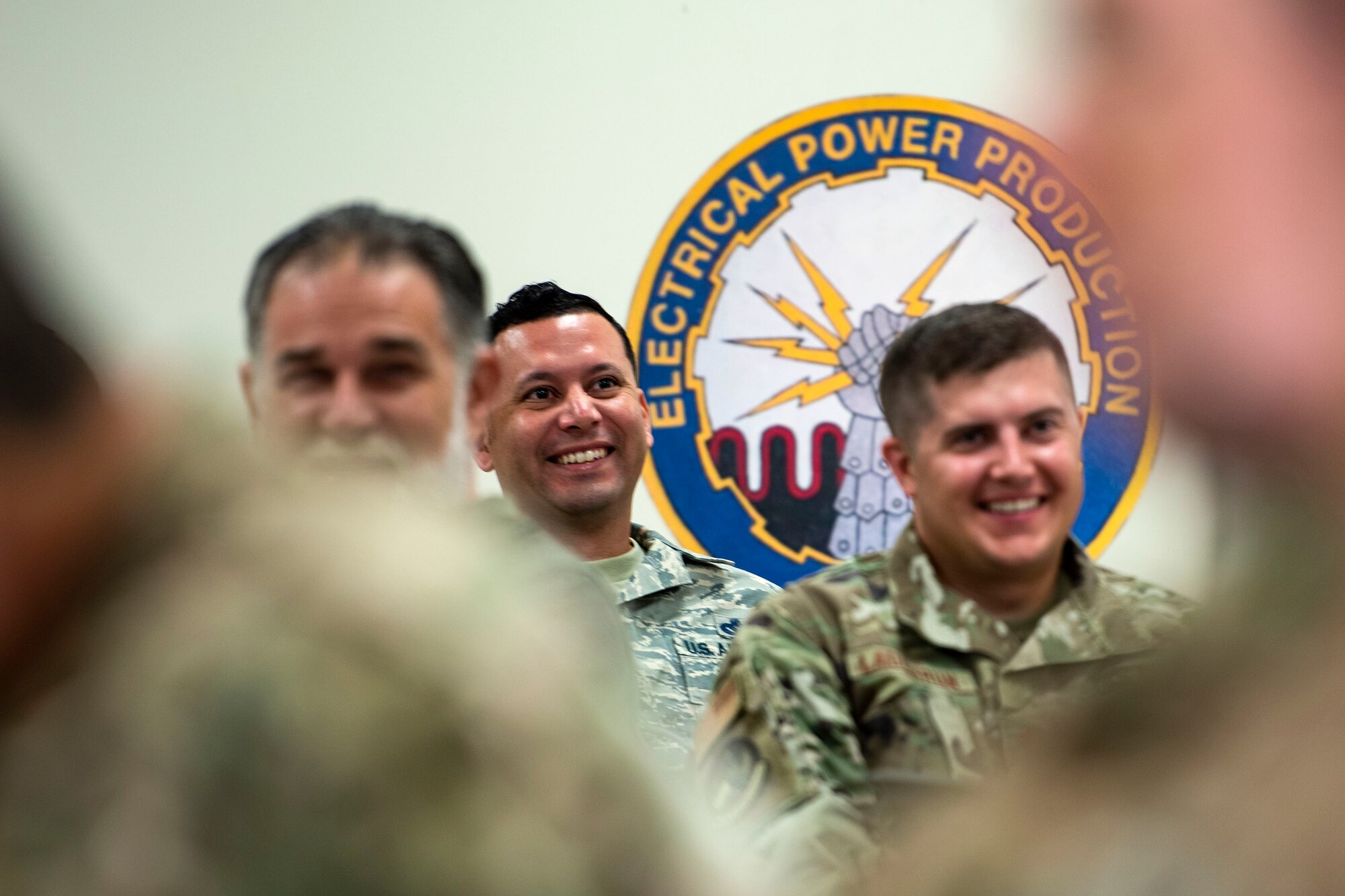 Airmen from the 23d Civil Engineer Squadron share a smile during resiliency training Sept. 10, 2019, at Moody Air Force Base, Ga. The event was hosted by the 23d Wing chaplain, and served as an interactive experience for Airmen, providing practical approaches they can use regularly to improve the resiliency culture in their squadrons. (U.S. Air Force photo by Senior Airman Erick Requadt)