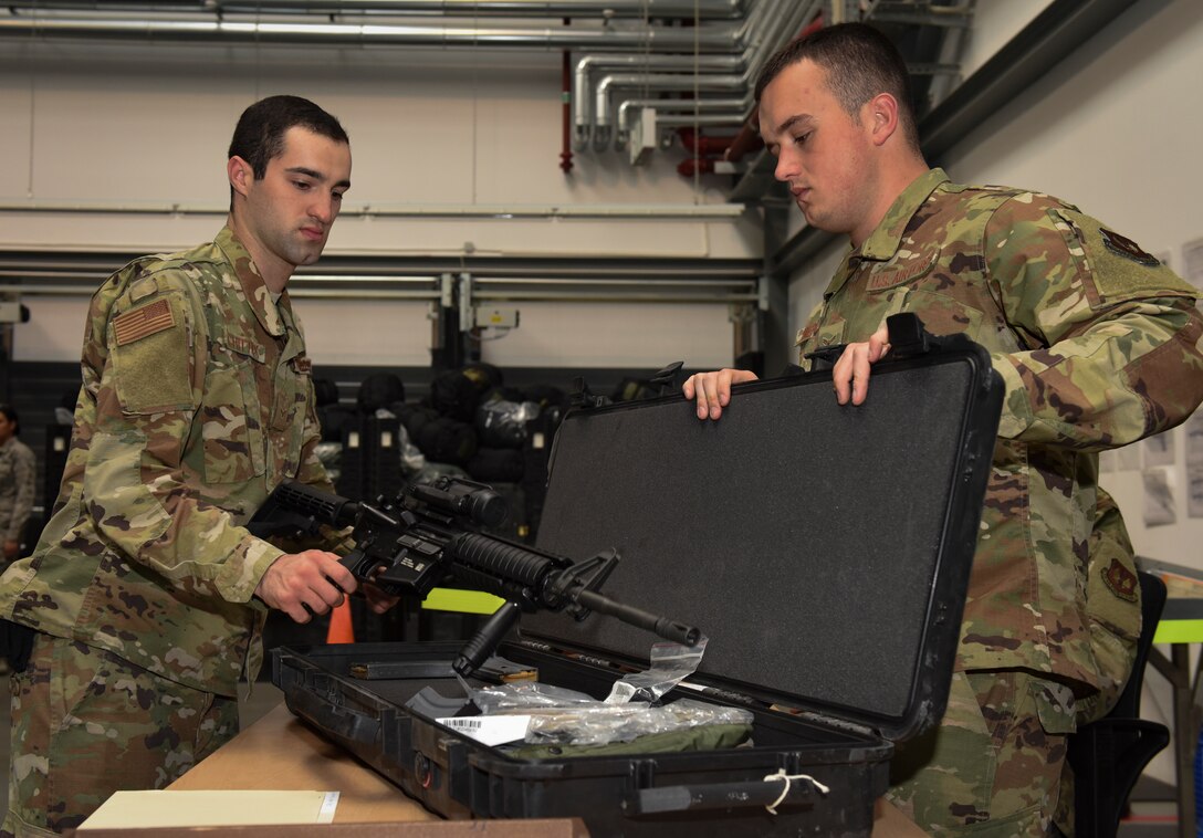 U.S. Air Force Airman 1st Class Jerrett Meredith, 86th Logistics Readiness Squadron base defense armory journeyman, practices issuing an M16 rifle to Airman 1st Class Joshua Chittick, 86th LRS Individual Protective Equipment journeyman, at Ramstein Air Base, Germany, Sept. 16, 2019. The 86th LRS is preparing for the 86th Airlift Wing Exercise Operation Varsity 19-03, which will test their readiness to continue supporting U.S. and NATO allies across U.S Air Forces in Europe – Air Forces Africa.