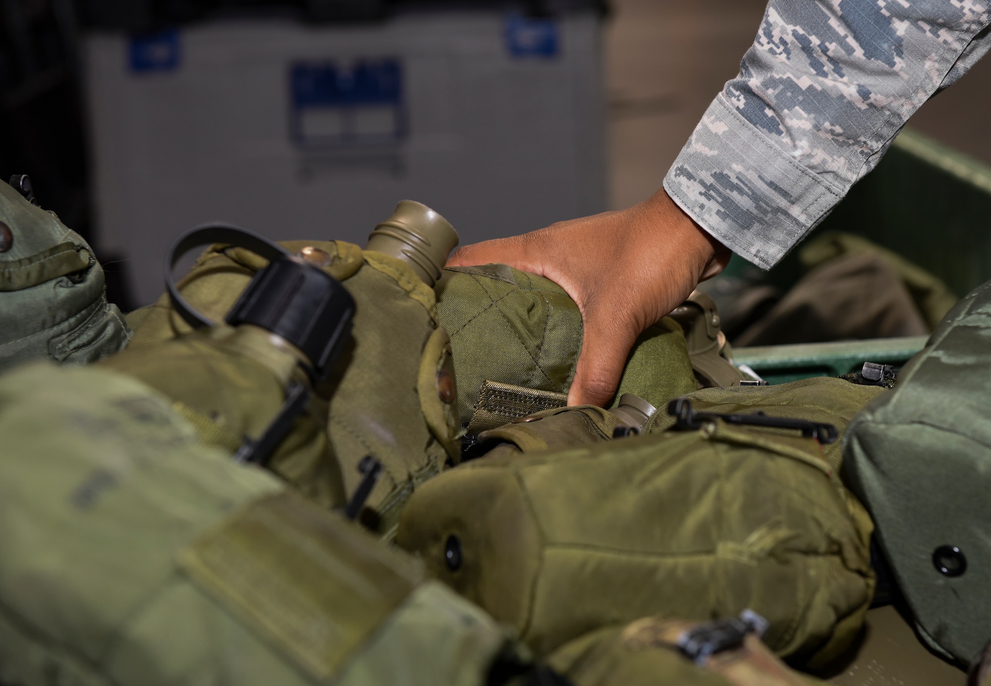 U.S. Airman 1st Class Ebony Wilkerson, 86th Logistics Readiness Squadron heavy parts store journeyman, picks out a training canteen at Ramstein Air Base, Germany, Sept. 16, 2019. In preparation for the 86th Airlift Wing Exercise Operation Varsity 19-03, the 86th LRS practiced issuing chemical, biological, radiological, nuclear and explosive material protective equipment such as canteens, helmets, weapons, and gas masks, which emergency personnel would use to respond to a CBRN attack.