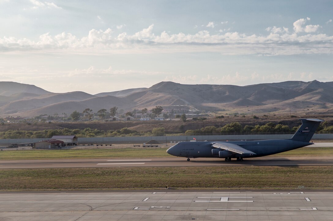 U.S. Air Force airmen depart in a C-5M Super Galaxy from Marine Corps Air Station Camp Pendleton, California, Sept. 16, 2019. The C-5M was a visiting U.S. Air Force aircraft from 433rd Airlift Wing, and was here as part of a dual service training exercise.The air station provides the 1st Marine Expeditionary Force and 3rd Marine Aircraft Wing with flexible deployment options. (U.S. Marine Corps photo by Lance Cpl. Drake Nickels)