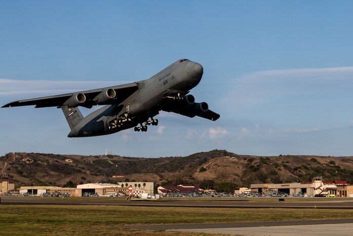 U.S. Air Force Airmen take off in a C-5M Super Galaxy from Marine Corps Air Station Camp Pendleton, California, Sept. 16, 2019. The C-5M was a visiting U.S. Air Force aircraft from 433rd Airlift Wing, and was here as part of a dual service training exercise. The air station provides the 1st Marine Expeditionary Force and 3rd Marine Aircraft Wing with flexible deployment options.