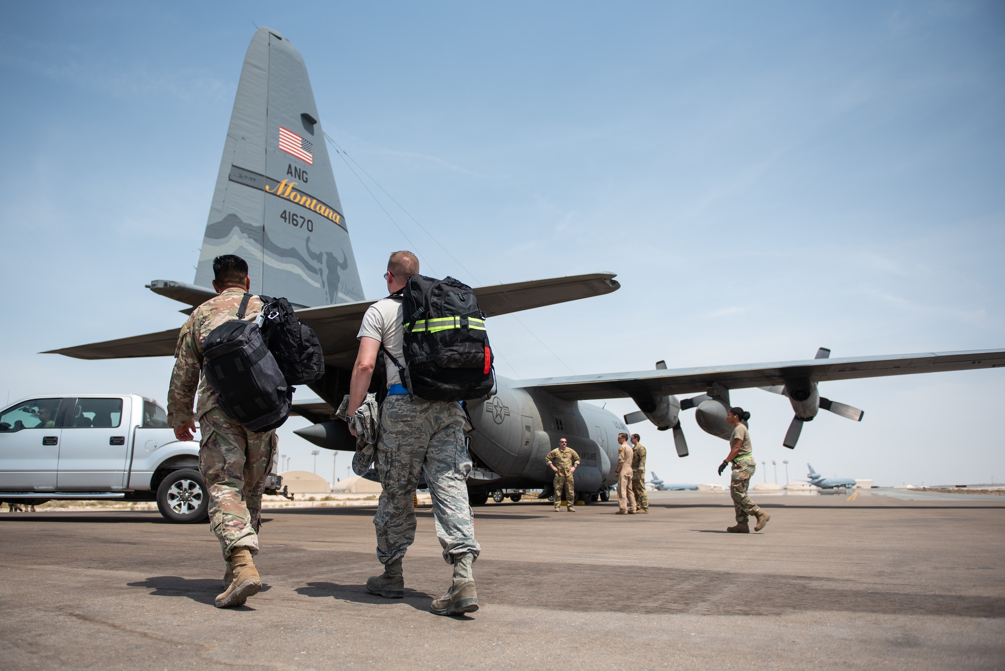 Members of the 336th Expeditionary Fighter Squadron walk up to a C-130 Hercules to forward deploy Sept. 17, 2019, at Al Dhafra Air Base, United Arab Emirates. The unit traveled to Price Sultan Air Base, Saudi Arabia, to operate missions and challenge their flexibility at expanding tactical and strategic reach while strengthening coalition and regional partnerships in the Air Forces Central Command area of responsibility. (U.S. Air Force photo by Staff Sgt. Chris Thornbury)