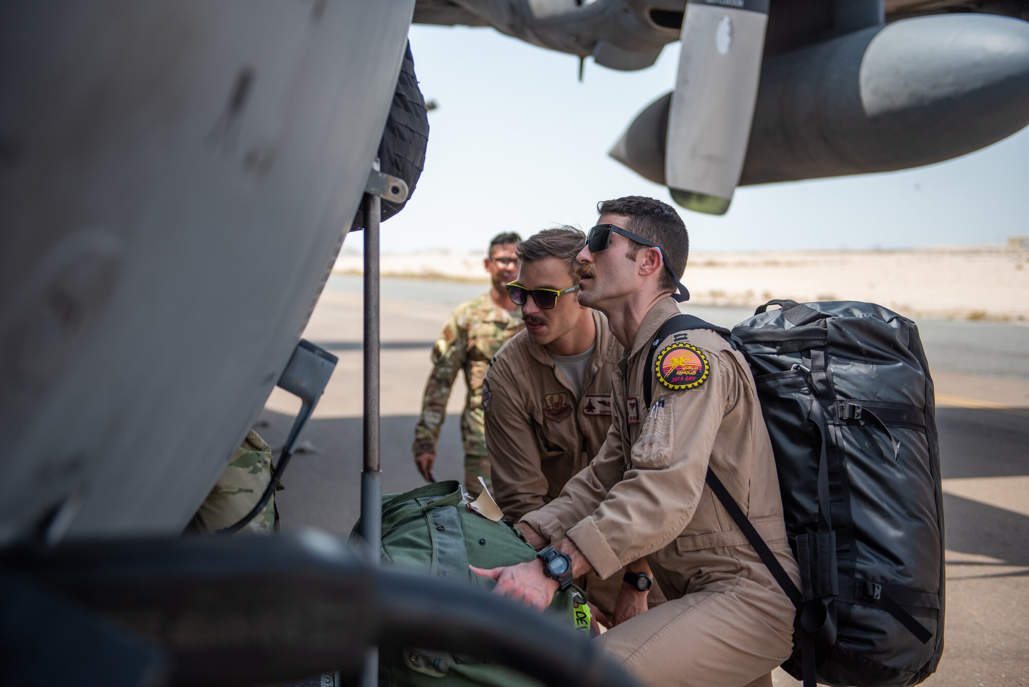 Members of the 336th Expeditionary Fighter Squadron walk up to a C-130 Hercules to forward deploy Sept. 17, 2019, at Al Dhafra Air Base, United Arab Emirates. The unit traveled to Price Sultan Air Base, Saudi Arabia to operate missions and challenge their flexibility at expanding tactical and strategic reach while strengthening coalition and regional partnerships in the Air Forces Central Command area of responsibility. (U.S. Air Force photo by Staff Sgt. Chris Thornbury)