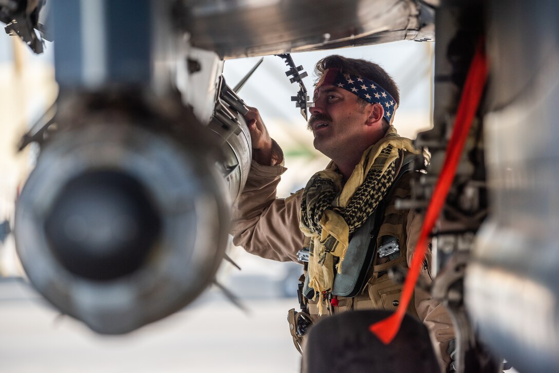 Capt. “Nuke” Messmore, 336th Expeditionary Fighter Squadron combat weapons system officer, inspects munitions before flying for Agile Strike Sept. 18, 2019, at Al Dhafra Air Base, United Arab Emirates. The 336th EFS sent two aircraft and personnel to operate missions and challenge their flexibility at expanding tactical and strategic reach while strengthening coalition and regional partnerships in the Air Forces Central Command area of responsibility through adaptive basing. (U.S. Air Force photo by Staff Sgt. Chris Thornbury)