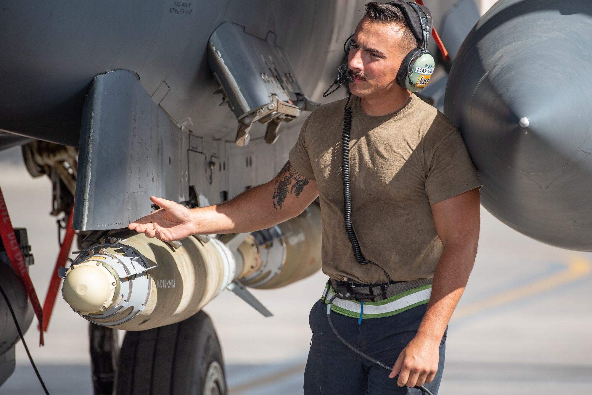 Airman 1st Class Brandon Maximovich, 380th Expeditionary Aircraft Maintenance Squadron F-15E Strike Eagle crew chief, performs a pre-flight inspection before takeoff for Agile Strike Sept. 18, 2019, at Al Dhafra Air Base, United Arab Emirates. The 336th EFS sent two aircraft and personnel to operate missions out of Prince Sultan Air Base, Saudi Arabia to challenge their flexibility at expanding tactical and strategic reach while strengthening coalition and regional partnerships in the Air Forces Central Command area of responsibility through adaptive basing. (U.S. Air Force photo by Staff Sgt. Chris Thornbury)