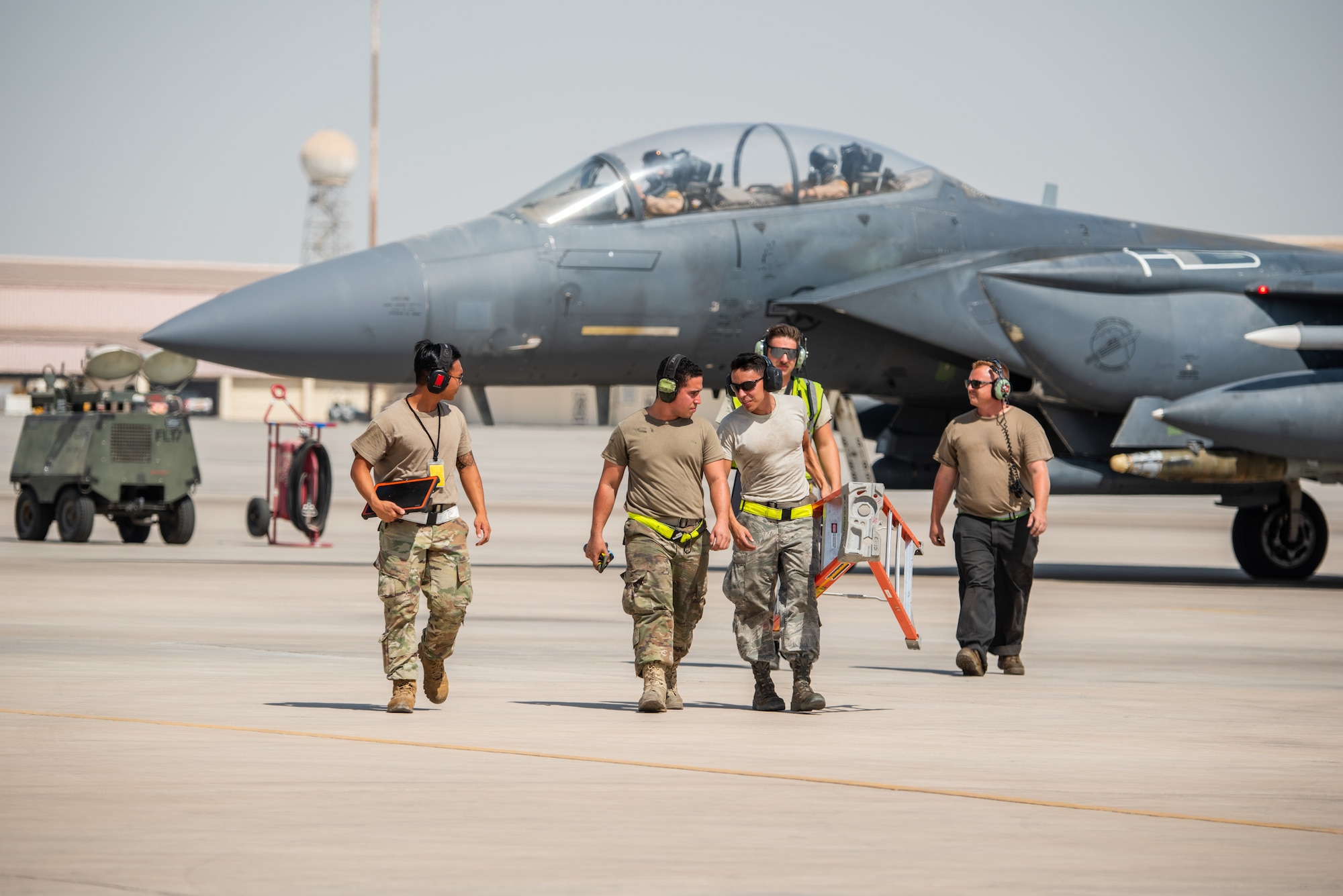 Weapons load crew members walk away from an F-15E Strike Eagle after arming munitions before flight for Agile Strike Sept. 18, 2019, at Al Dhafra Air Base, United Arab Emirates. The 336th EFS sent two aircraft and personnel to operate missions out of Prince Sultan Air Base, Saudi Arabia to challenge their flexibility at expanding tactical and strategic reach while strengthening coalition and regional partnerships in the Air Forces Central Command area of responsibility through adaptive basing. (U.S. Air Force photo by Staff Sgt. Chris Thornbury)