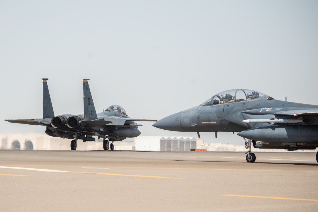 Two F-15E Strike Eagles, assigned to the 336th Expeditionary Fighter Squadron, taxi before flight for Agile Strike Sept. 18, 2019, at Al Dhafra Air Base, United Arab Emirates. The 336th EFS sent two aircraft and personnel to operate missions out of Prince Sultan Air Base, Saudi Arabia to challenge their flexibility at expanding tactical and strategic reach while strengthening coalition and regional partnerships in the Air Forces Central Command area of responsibility through adaptive basing. (U.S. Air Force photo by Staff Sgt. Chris Thornbury)