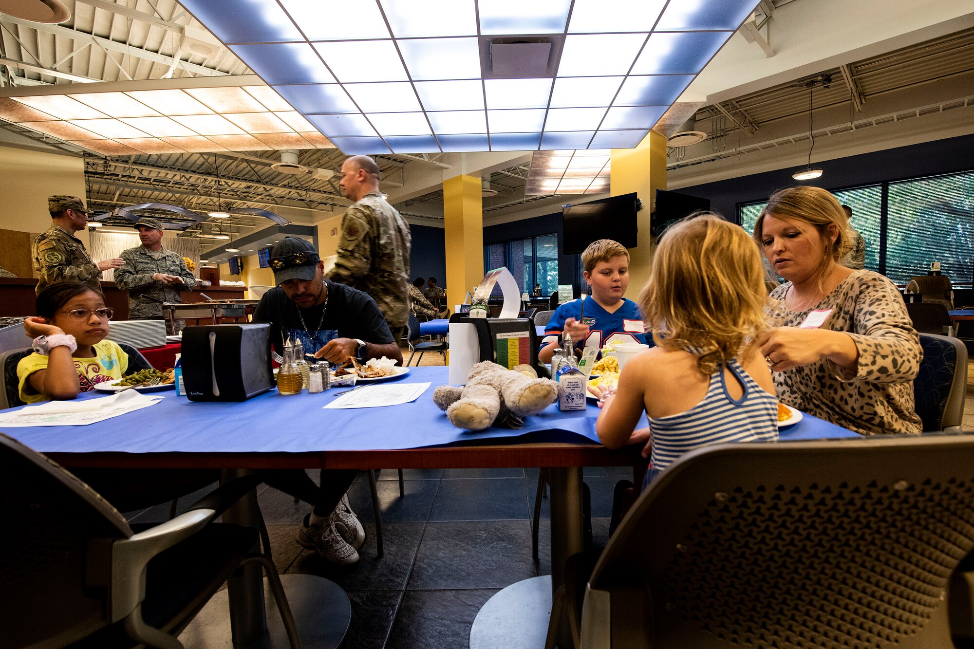 Families eat together during a Deployed Spouses Dinner Sept. 17, 2019, at Moody Air Force Base, Ga. The monthly event is a free dinner at Georgia Pines Dining Facility designed as a ‘thank you’ for each families’ support and sacrifice. The dinner, occurring on every third Tuesday of the month, provides an opportunity for spouses to interact with other families of deployed Airmen, key spouses and unit leadership, as well as provide a break for the spouse while military sponsor is deployed. The next Deployed Spouses Dinner will be Oct. 15. (U.S. Air Force photo by Senior Airman Erick Requadt)