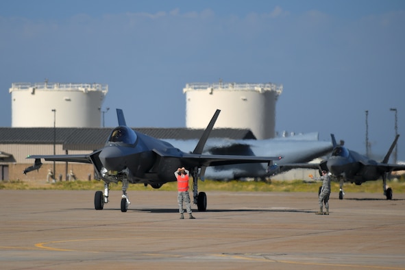 Airmen in the 388th Fighter Wing marshal jets prior to refueling them during a surge exercise here last week. From Sept. 9-13, the 34th and 421st Fighter Squadrons flew 240 sorties, roughly doubling what they normally fly in a week. (U.S. Air Force photo by Todd Cromar)